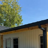 New black gutters installed on a home by Gutter Haven