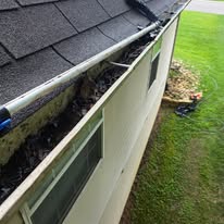 Gutter being professionally cleaned by Gutter Haven
