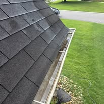 Gutter cleaned out along a shingle roof by Gutter Haven
