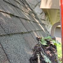 Clogged downspout elbow cleared by Gutter Haven